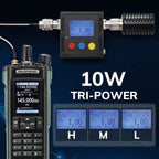 Tri-power UV-32 radio equipment with digital displays and power output indicators on a dark background.