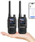 Two UV-5R Minis held in a hand with a smartphone displaying app interface.