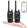 Two UV-5R Minis held in a hand with a smartphone displaying app interface.