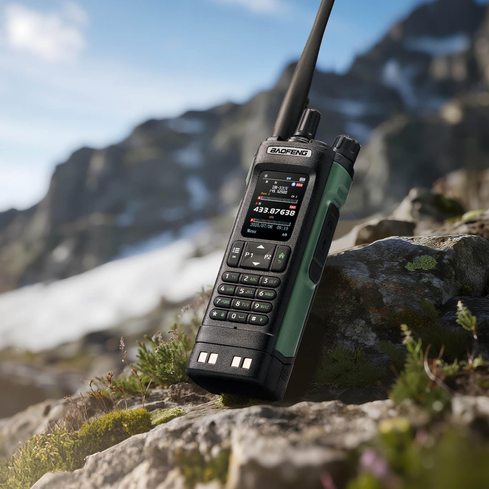 Rugged DM-32UV 10W Multi-Band DMR Radio on a rock with mountainous landscape in the background