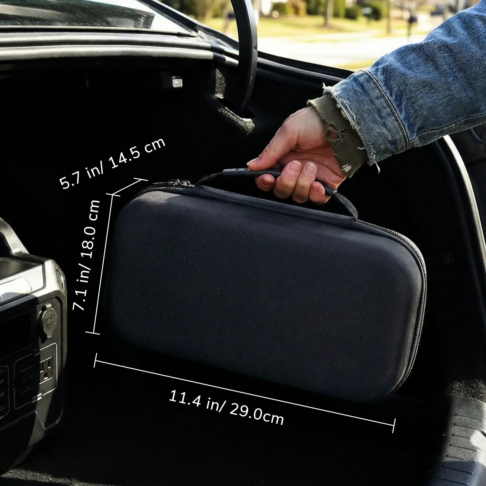 Black PB5 Walkie Talkie Carrying Case with dimensions being held by a person inside a car.