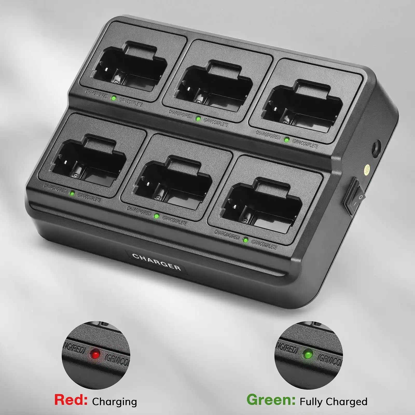 Black battery charger with six slots on a gray background