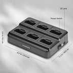 Black battery charger with labeled ports and dimensions on a gray background