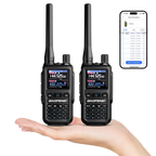 Two UV-5R Minis held in a hand with a smartphone displaying app interface.
